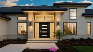 Modern house exterior with black entry door and warm porch lighting