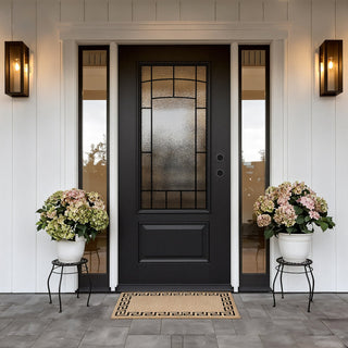A contemporary front entrance features a dark grey door with decorative rain glass panels